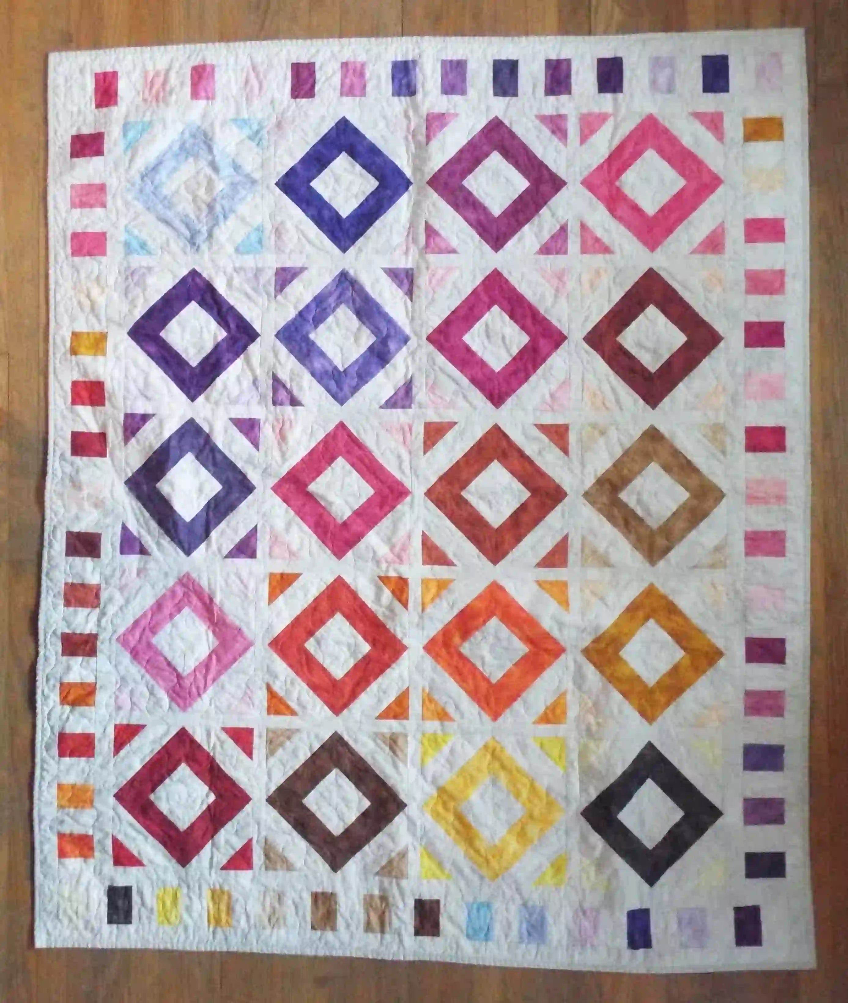 Flat lay of handmade lap quilt showing the entire quilt.