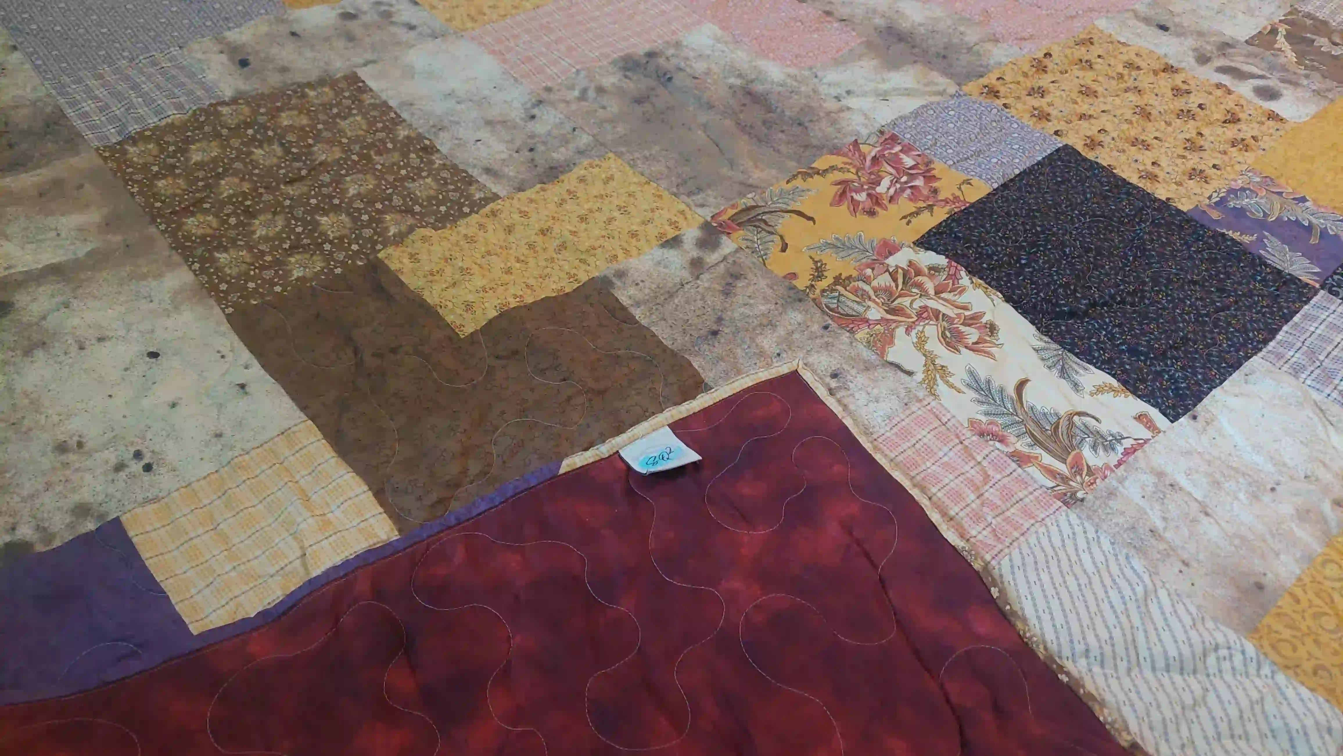Retro-Mod Orchid King quilt showing corner flipped over to see backing and stitching detail.