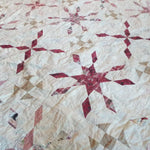 Detail shot of Scarlet Correspondence Queen Quilt showing stitching and fabrics.