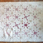 Scarlet Correspondence Queen Quilt flat lay showing entire quilt.