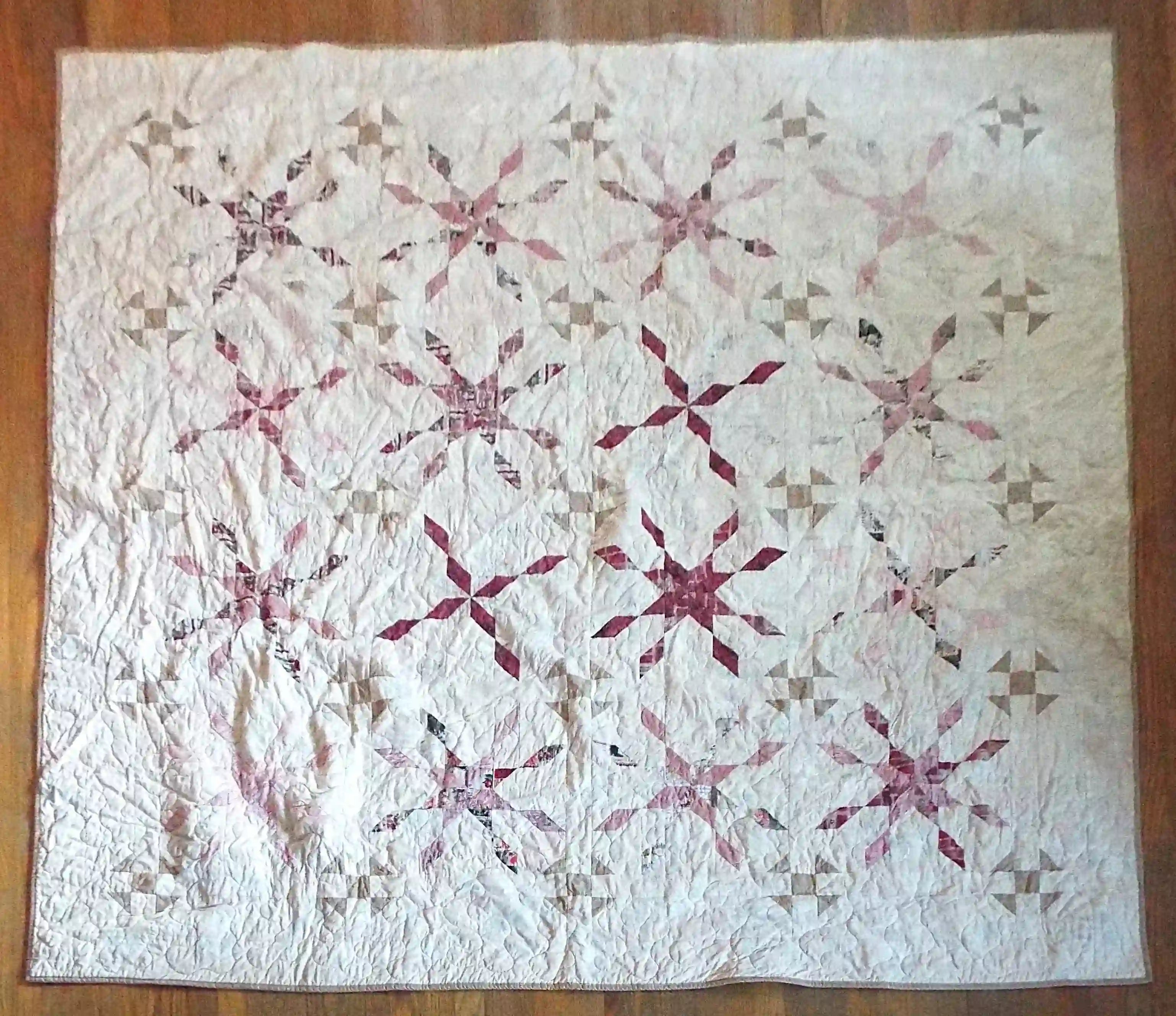 Scarlet Correspondence Queen Quilt flat lay showing entire quilt.