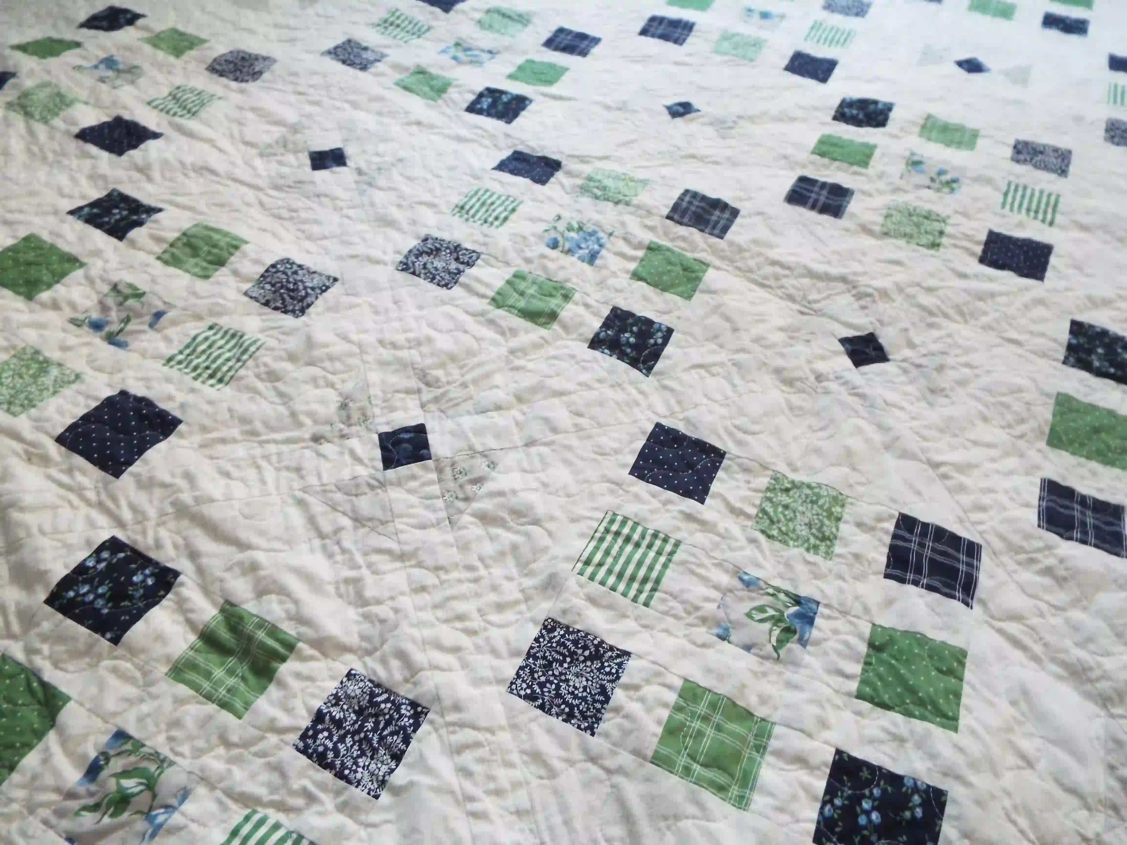 Detail of Shoreline queen quilt's stitching