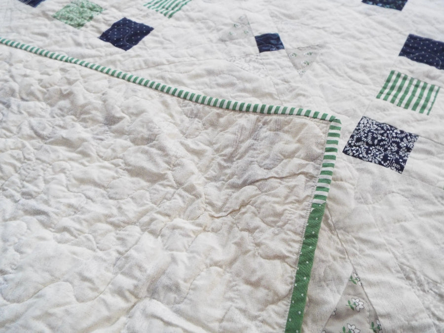 shoreline queen quilt with backing flipped over