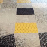 close up of handmade queen somerset blues quilt