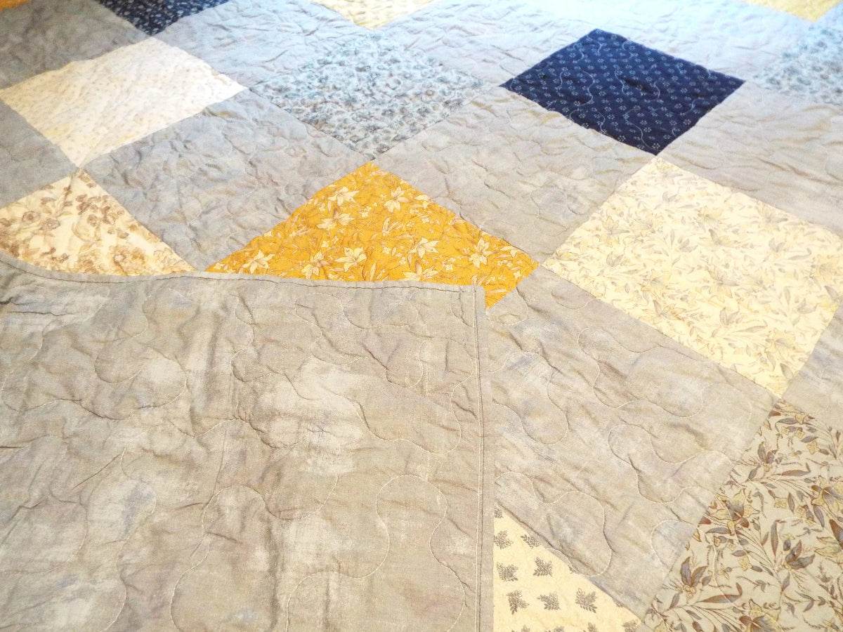 queen quilt with backing flipped over