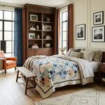 Softspoken Summer King Quilt shown in an architecturally collected designed bedroom.