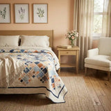 Softspoken Summer King Quilt shown in a simply decorated bedroom.