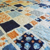 Detail of Softspoken Summer King quilt showing stitching detail.