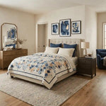 Softspoken Summer King quilt shown in a simply decorated modern bedroom.