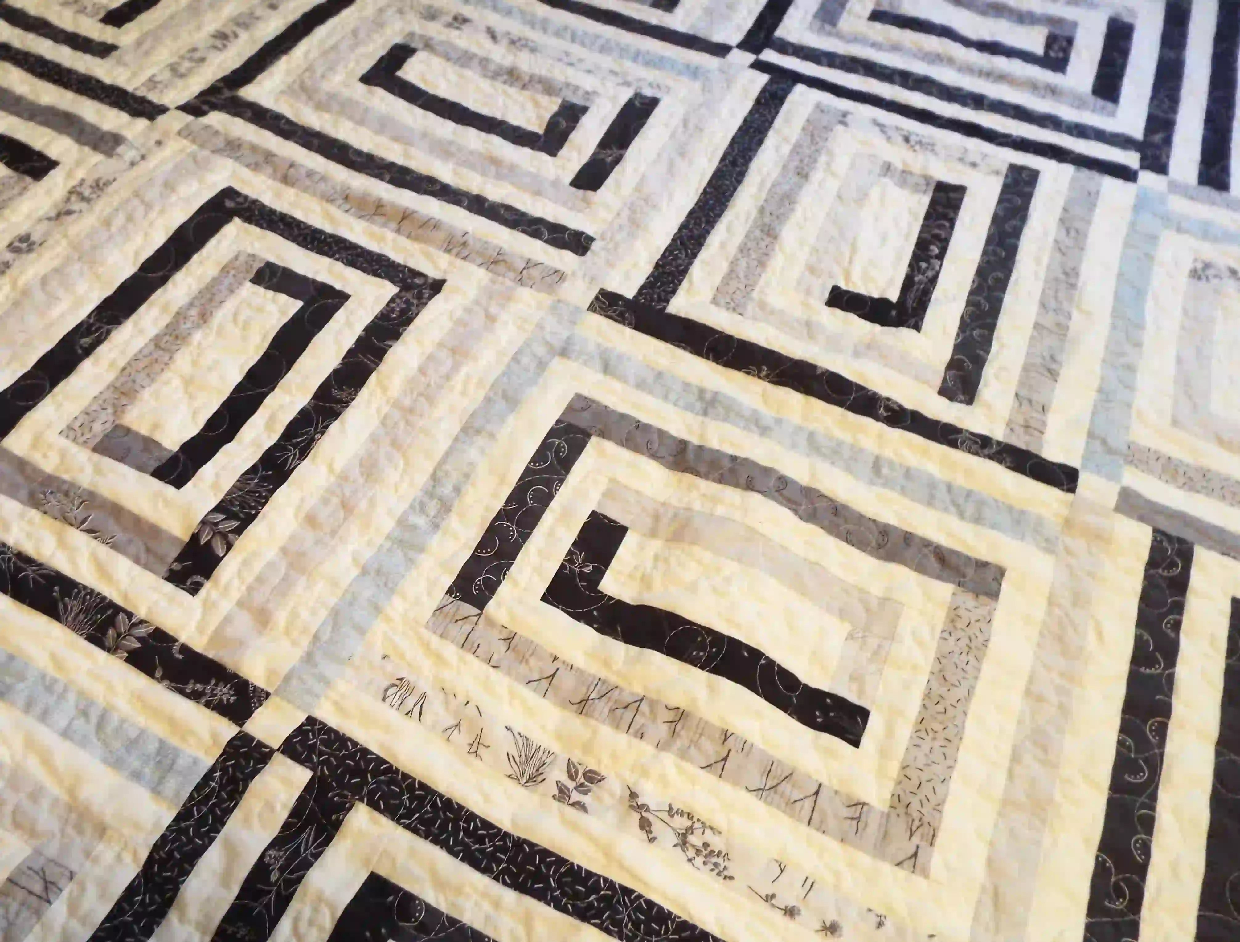 Close up of finished black and white handmade twin quilt