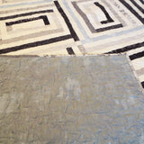 Quilt with corner flipped up to show backing as well as top and quilting stitches