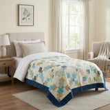 Handmade twin quilt shown in a stylized modern classic bedroom with neutral walls and minimal decor