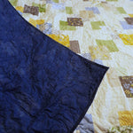 Spring Brook Handmade Twin/Full Quilt showing backing flipped over onto quilt top