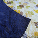 Spring Brook Handmade Twin/Full Quilt showing backing flipped over onto quilt top