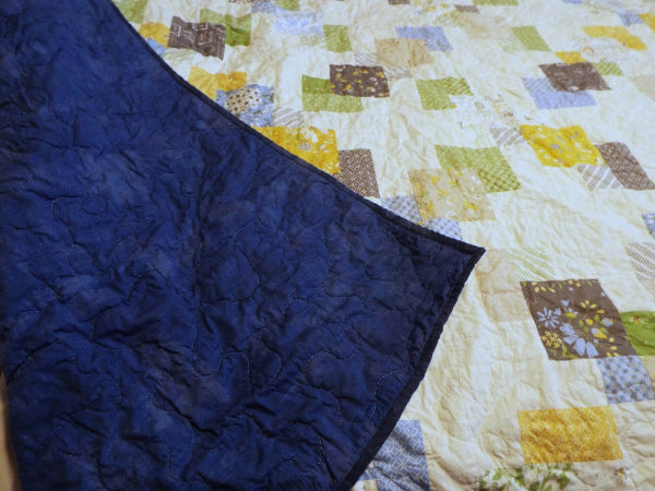 Spring Brook Handmade Twin/Full Quilt showing backing flipped over onto quilt top