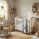 Starlit Trails draped over an off white crib in a cozy nursery