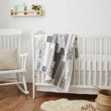 Starlit Trails shown in a minimal nursery draped over a crib