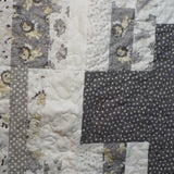 close up of stitching on Starlit Trails gray baby quilt