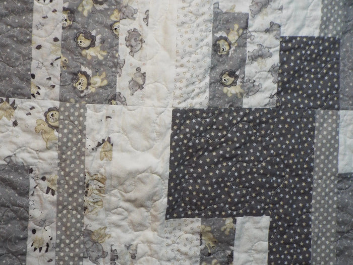 close up of stitching on Starlit Trails gray baby quilt