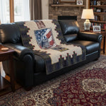 Army Eagle tribute quilt shown over a black leather sofa