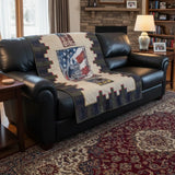 Army Eagle tribute quilt shown over a black leather sofa