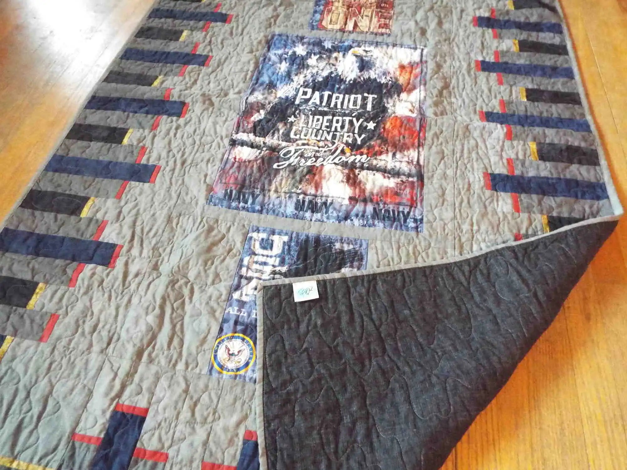 Eagle tribute quilt showing corner flipped for backing and better view of stitching