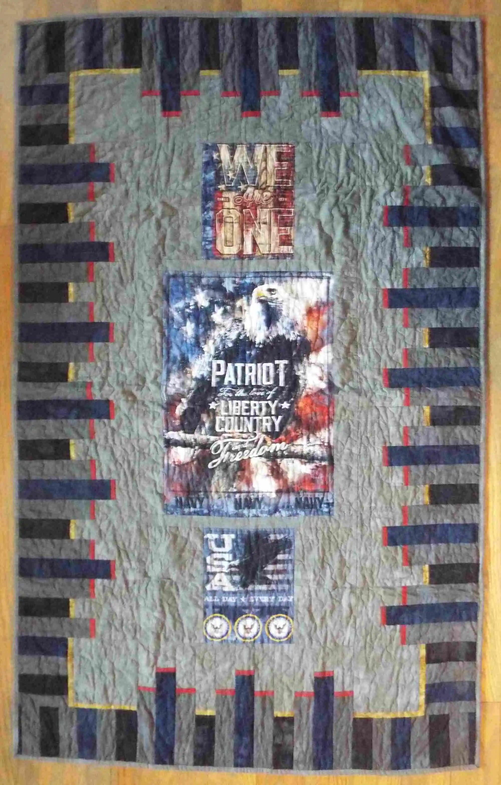 Flat lay of eagle tribute quilt showing entire quilt top