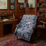 Eagle tribute quilt shown draped on leather chair in study