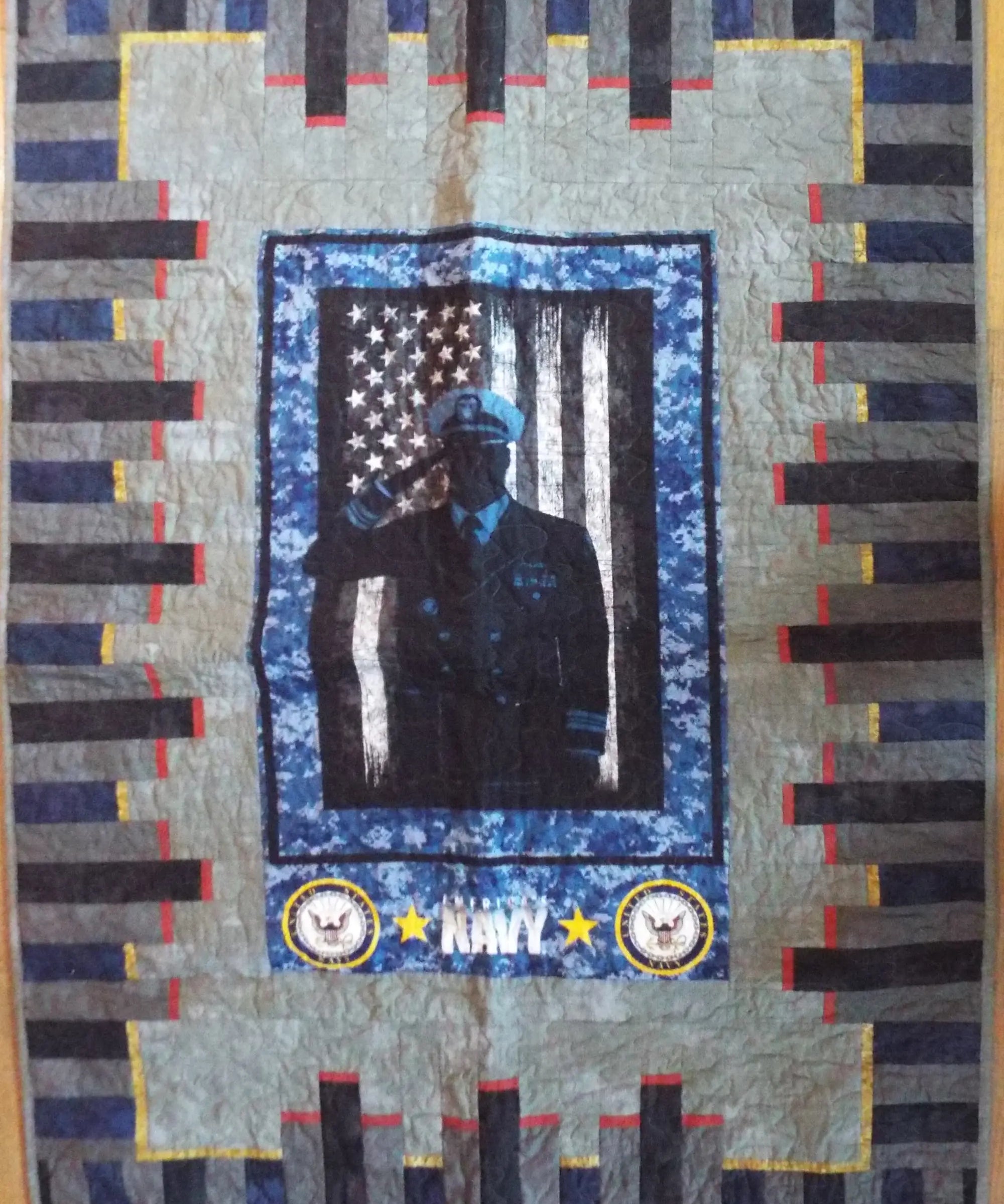 Flat lay of tribute quilt displaying entire quilt