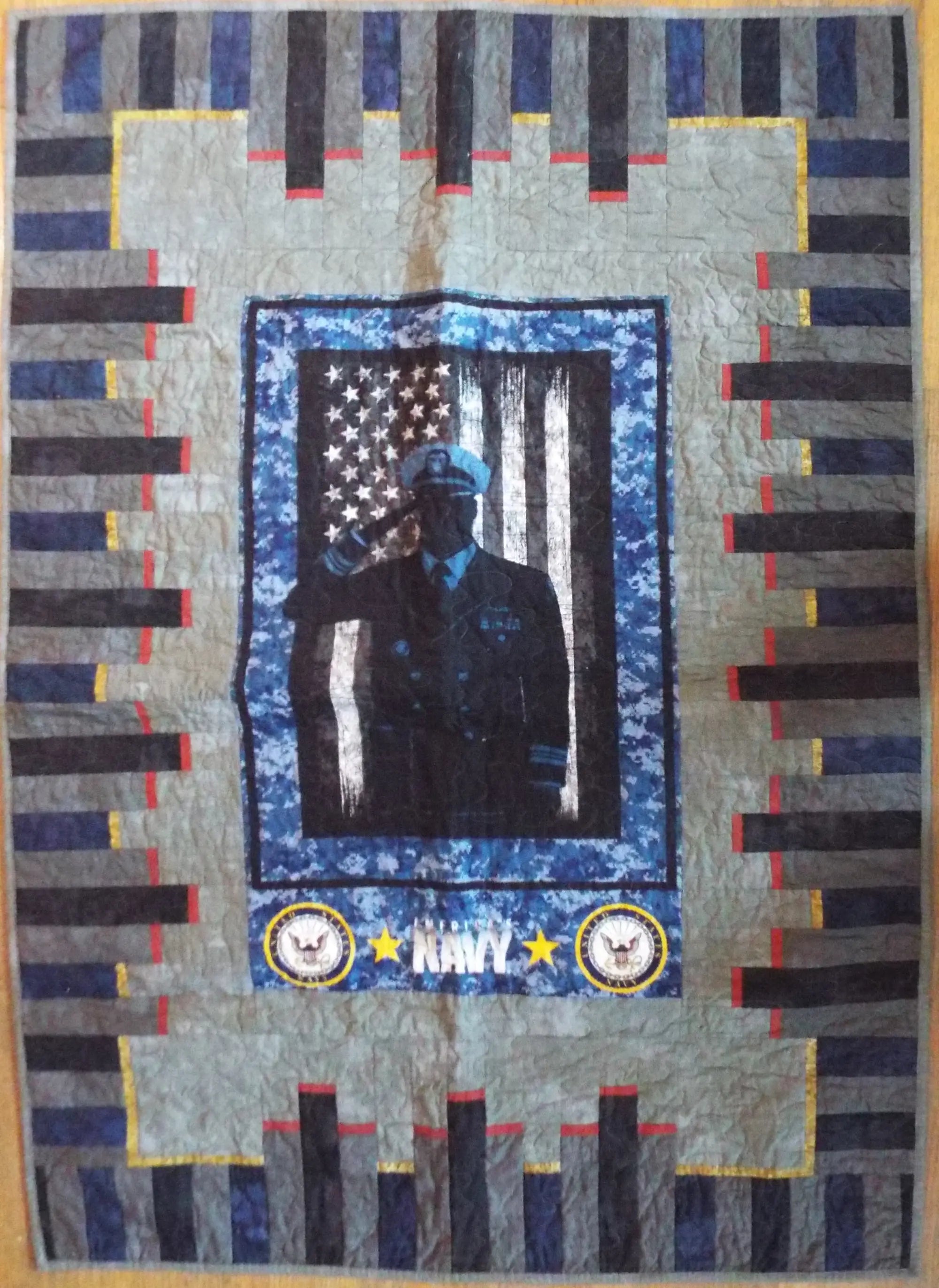 Flat lay of tribute quilt displaying entire quilt