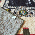 Soldier quilt with corner flipped over to show backing