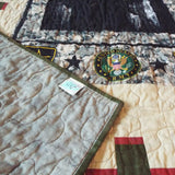 Soldier quilt with corner flipped over to show backing
