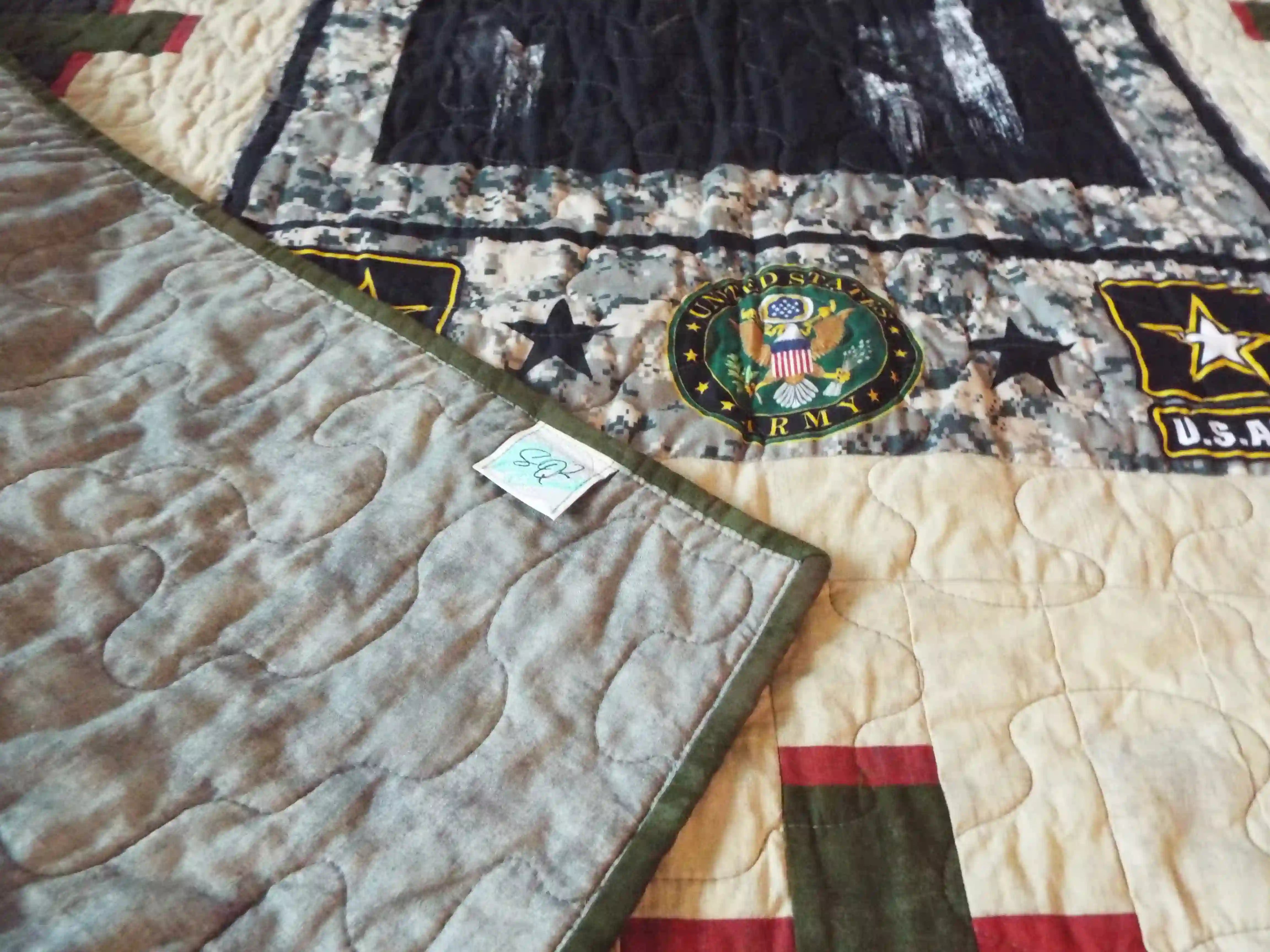 Soldier quilt with corner flipped over to show backing