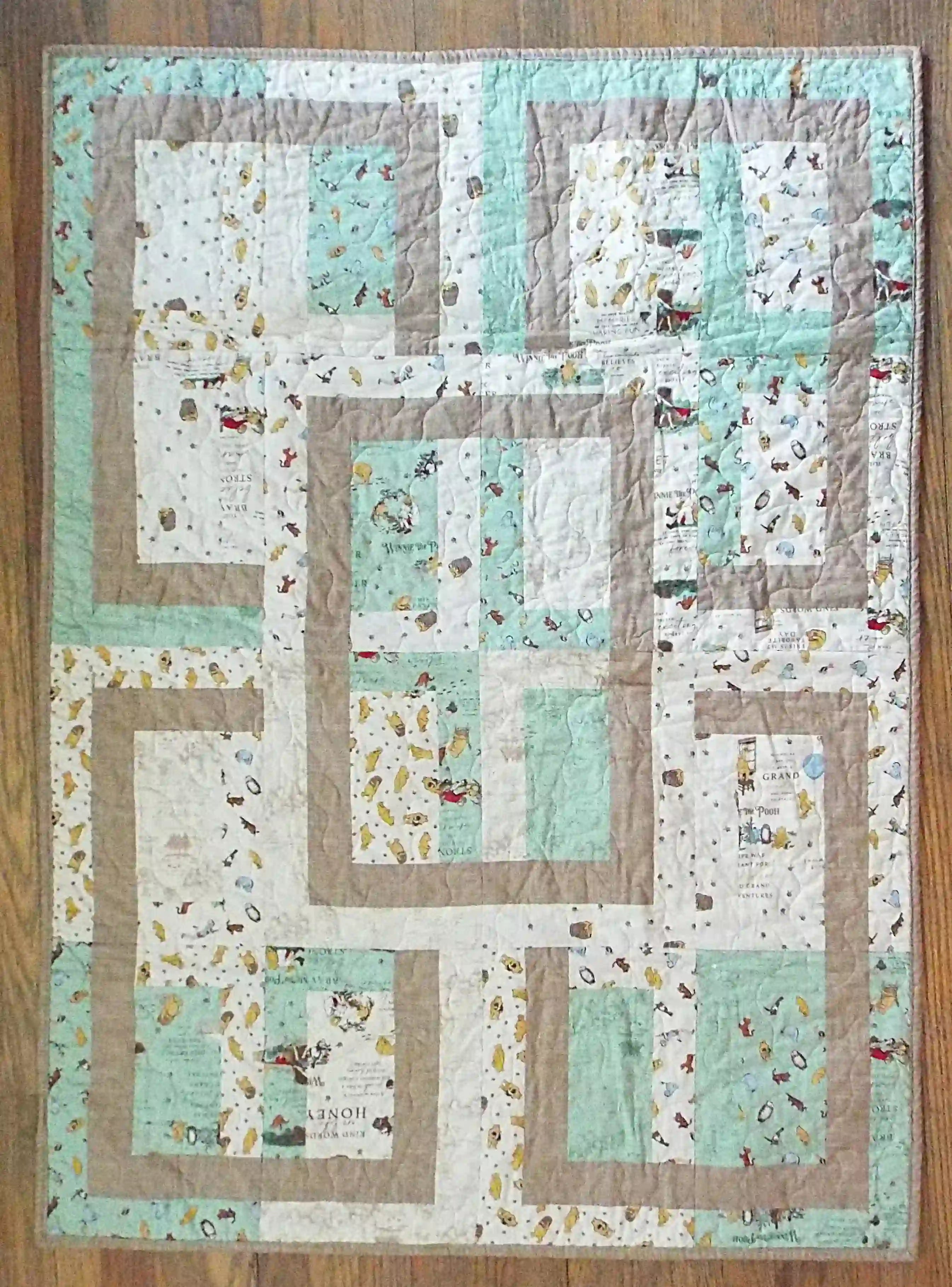 Flat lay of Stories in the Woods Baby Quilt showing entire quilt.