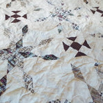 Close up of The Archivist Queen Quilt showing stitching detail and fabric detail.