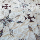 Close up of The Archivist Queen Quilt showing stitching detail and fabric detail.