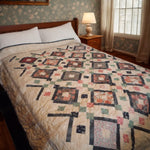 Handmade twin quilt in rose and green with dark gray accents shown on bed in a traditionally decorated bedroom