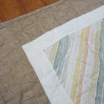 Closer look at quilt stitching and binding of handmade quilt