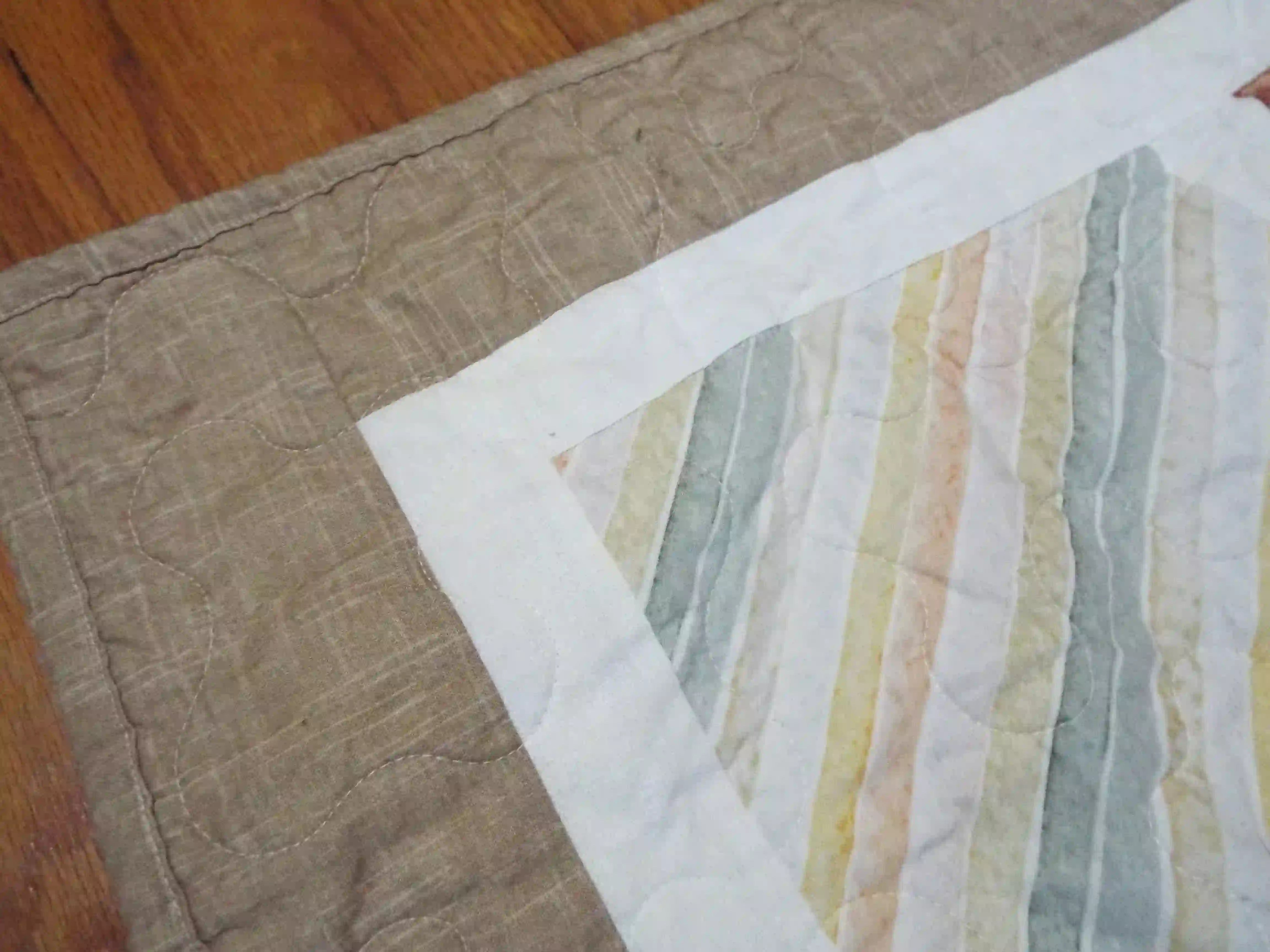Closer look at quilt stitching and binding of handmade quilt