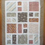 Flat lay of handmade quilt showing entire quilt.