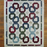 Flat lay of Winter Links Lap Quilt showing entire quilt.