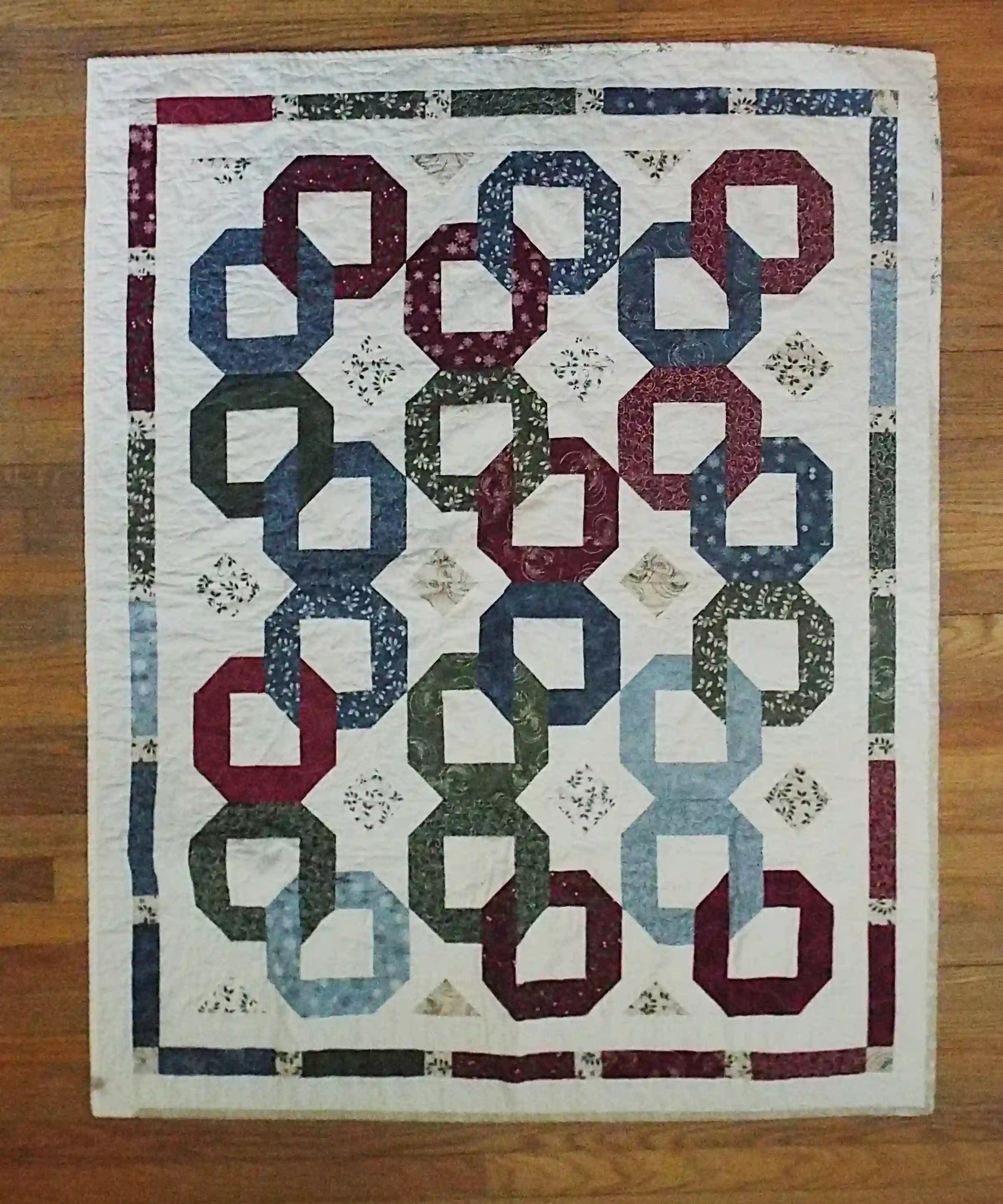 Flat lay of Winter Links Lap Quilt showing entire quilt.