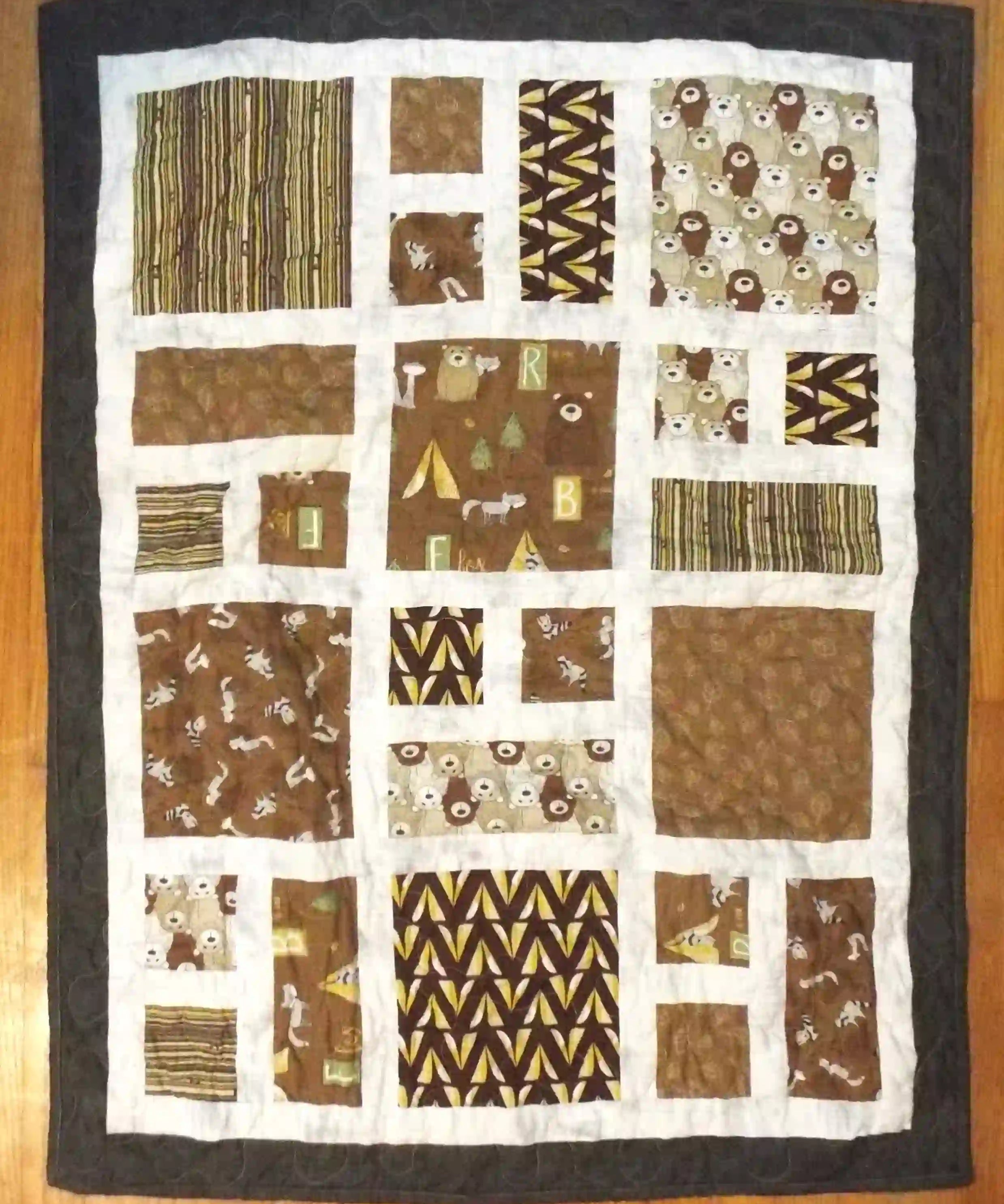 Flat lay of handmade baby quilt showing entire quilt