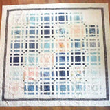 Flat lay of Woven Breeze queen showing entire pattern and fabrics.