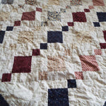 Woven Freedom lap quilt detail showing stitching and fabrics