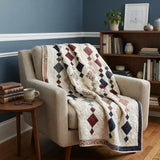 Woven Freedom shown draped over a chair in a reading nook