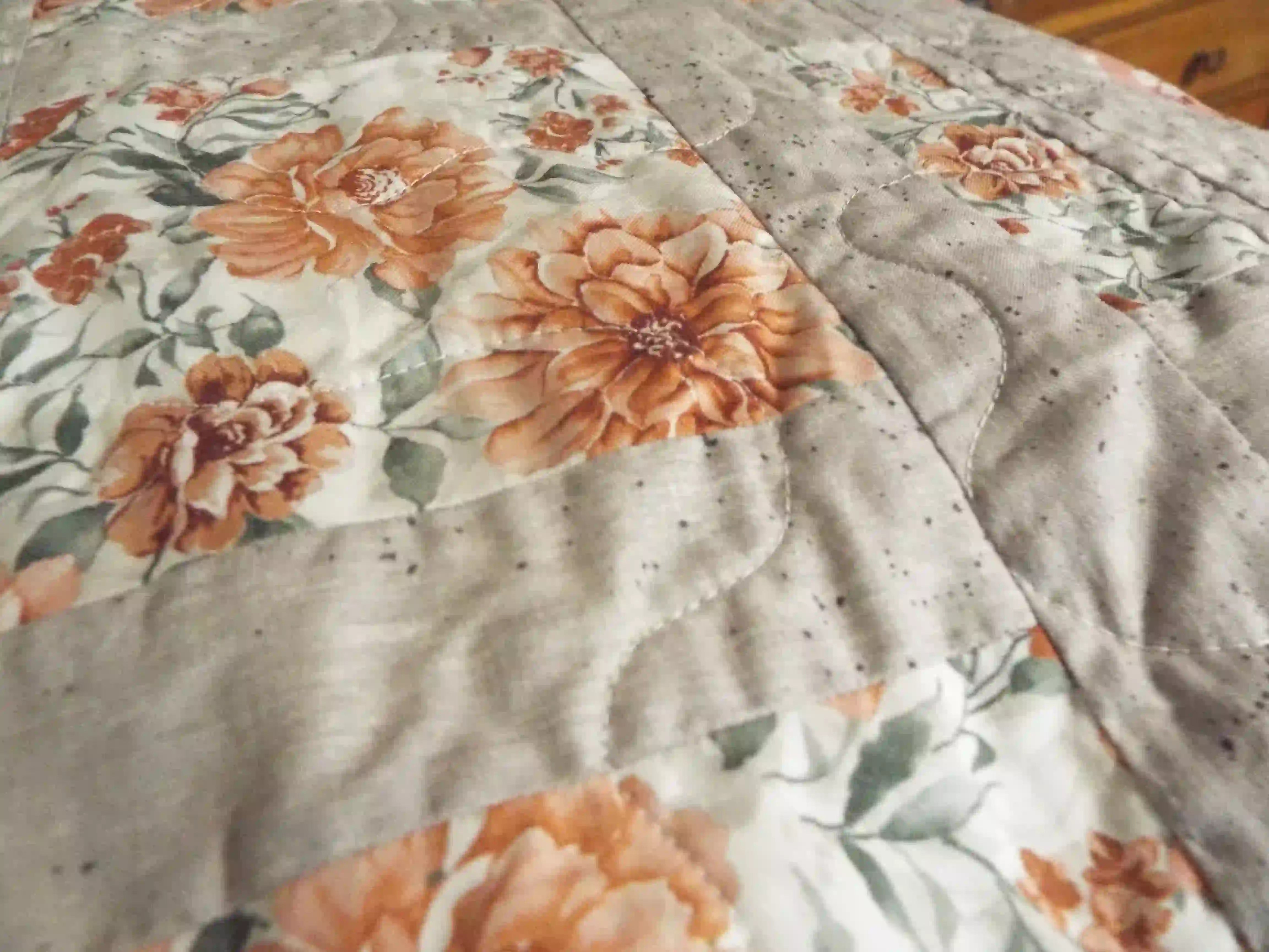 Detail of quilt stitching on Woven Stillness queen quilt.
