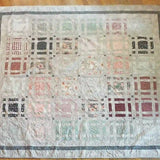 Woven Stillness queen quilt flat lay showing entire quilt and fabrics used