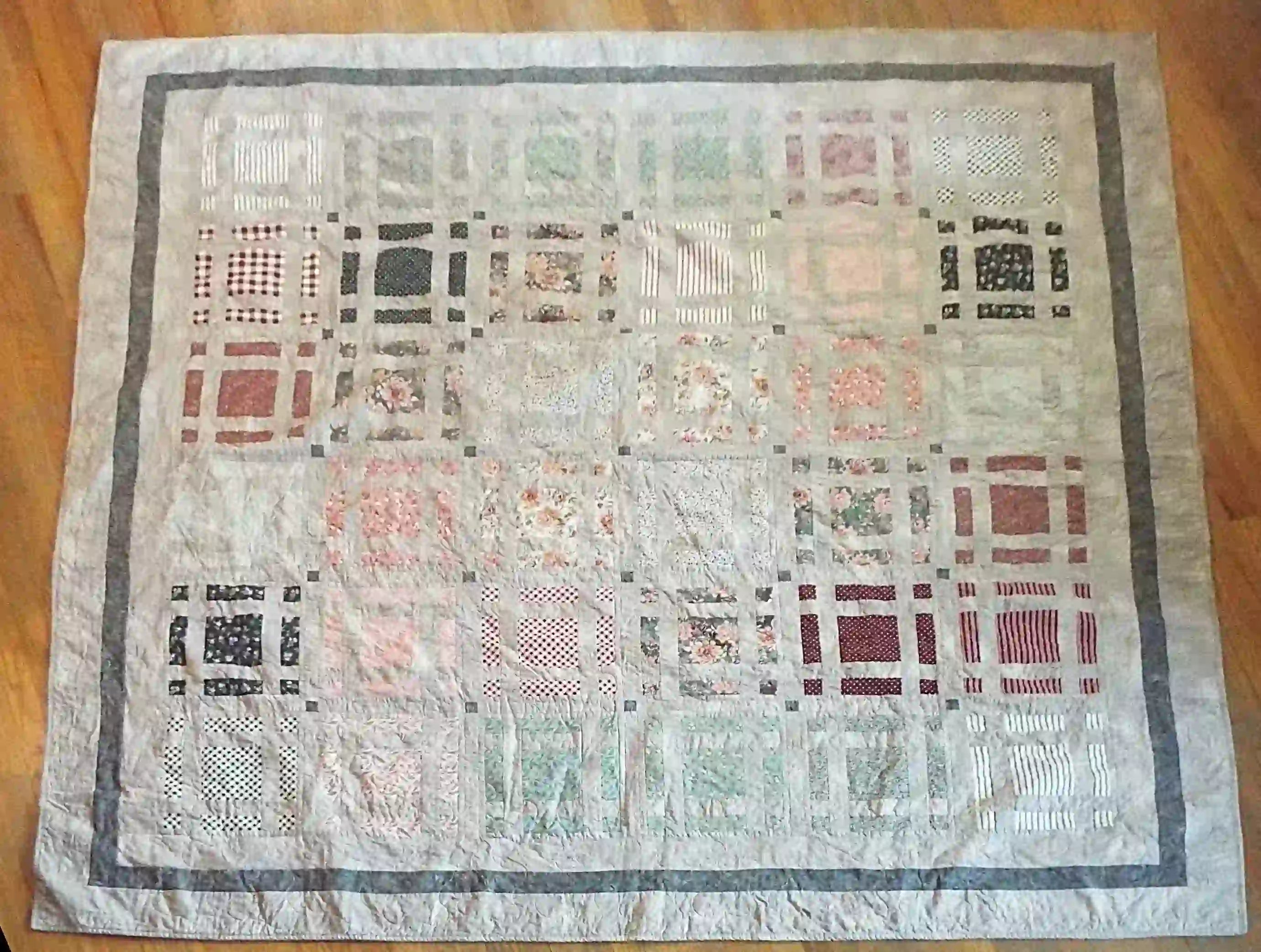 Woven Stillness queen quilt flat lay showing entire quilt and fabrics used