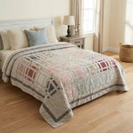 Woven Stillness queen quilt shown in a neutral farmhouse inspired bedroom.